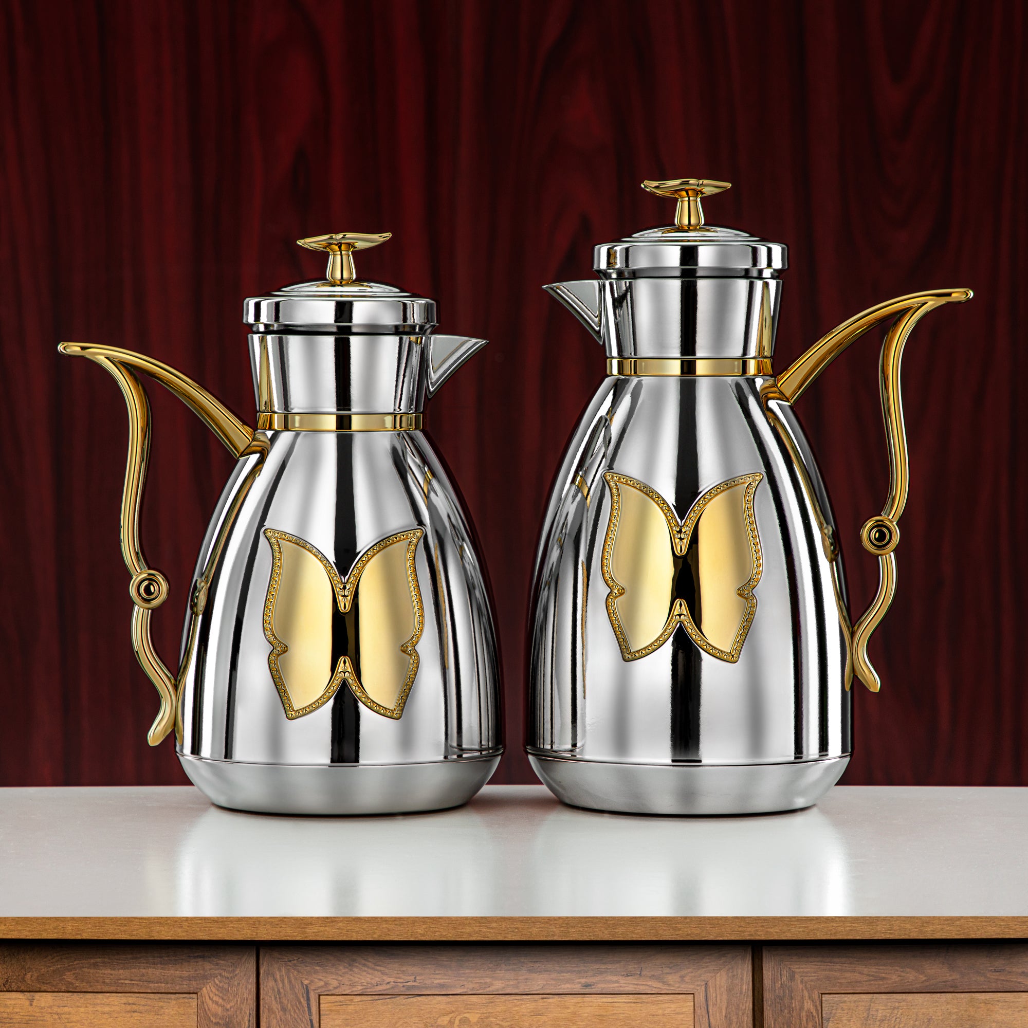 طقم ترامس المرجان زر ضغط بلاستيك 0.7 لتر + 1 لتر فضي وذهبي (SM-2C142-070/100 C/G) - زجاجة شاي وقهوة